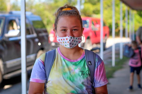 student smiles on first day of school